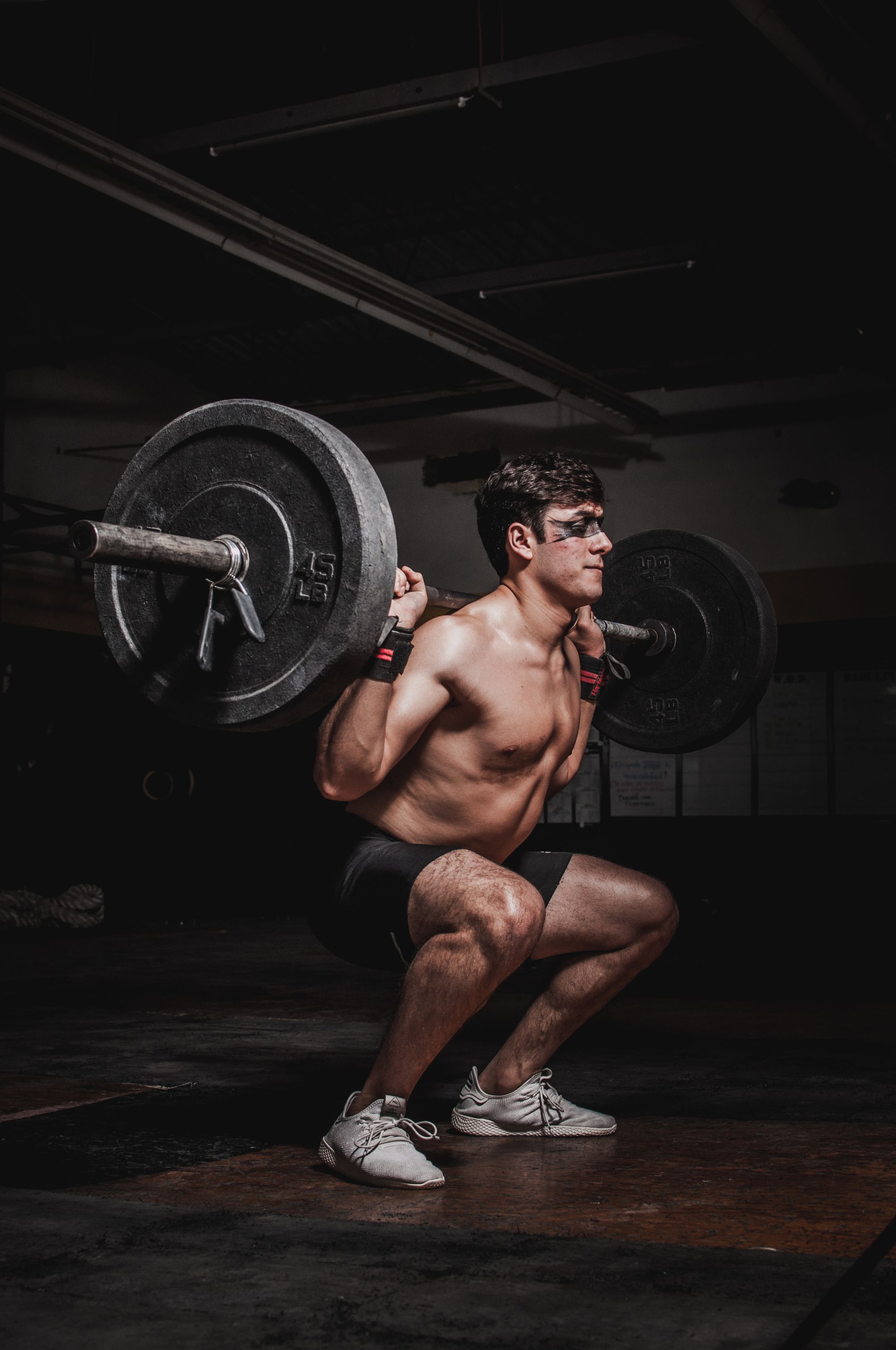 Lifter chalking up in an underground gym — EndlessVirtue
